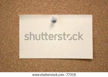 A post it note on a bulletin board.