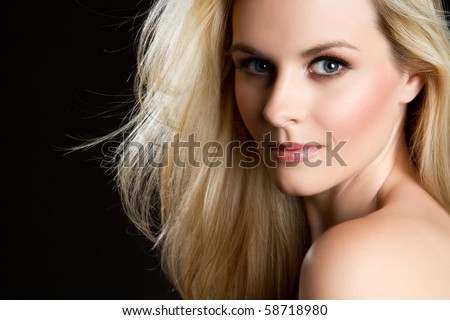 Beautiful blond woman on black