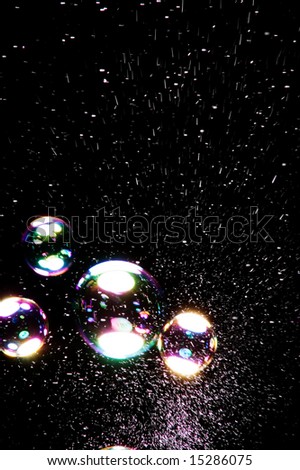 colored soap bubbles on black