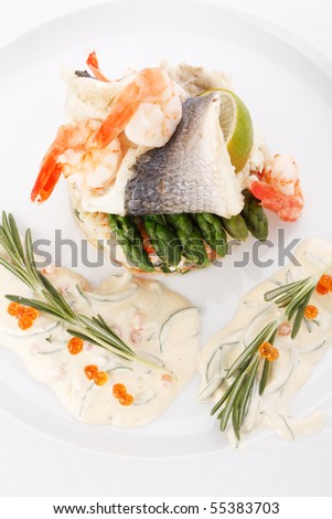 prepared fish with rice and vegetables