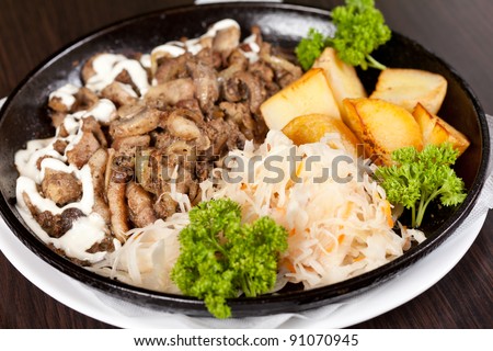 meat with potatoes in the pot