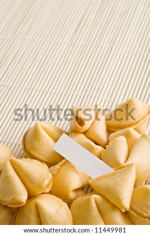fortune cookie - single cookie cracked open with paper to insert your own text, entire text area in clean focus