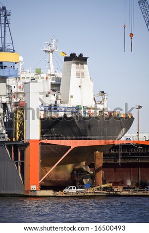 Ship In Dry Dock - Large Container Ship Rear View With Propeller Under ...