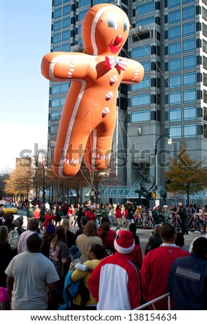 ATLANTA, GA - DECEMBER 1:  An inflated gingerbread man balloon floats through the parade route at the annual Atlanta Christmas parade on December 1, 2012 in Atlanta, GA.