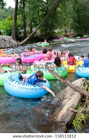 HELEN, GA - AUGUST 24:  Families enjoy tubing down the Chattahoochee River in North Georgia on a warm summer afternoon, on August 24, 2013 in Helen, GA.   Hundreds could be seen  tubing on the river.