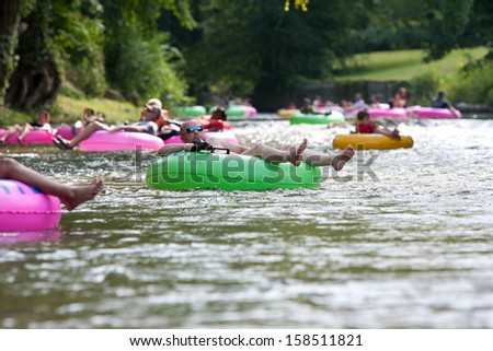 HELEN, GA - AUGUST 24:  People enjoy tubing down the Chattahoochee River in North Georgia on a warm summer afternoon, on August 24, 2013 in Helen, GA.  Hundreds of people went tubing down the river.