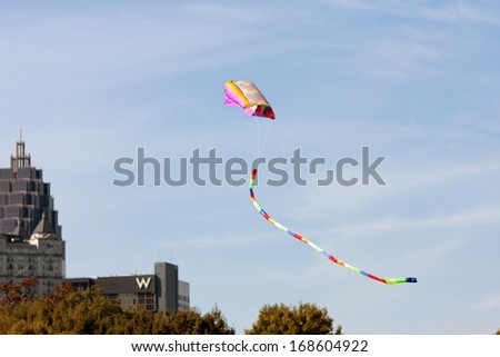 ATLANTA, GA - OCTOBER 26:  A woman gets her kite airborne at the World Kite Festival in Piedmont Park, on October 26, 2013 in Atlanta, GA.  The event was free to the public.