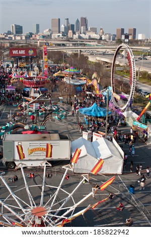 ATLANTA, GA - MARCH 15:  An elevated wide shot shows the annual Atlanta Fair, with city skyline in background, on March 15, 2014 in Atlanta, GA.  The fair has been an Atlanta tradition for 30 years.