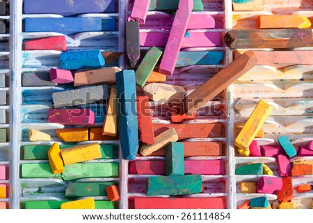 Several pieces of colorful chalk are used for street art