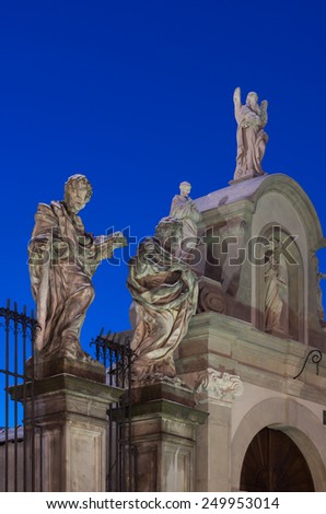 Baroque sculptures of the Apostles in front of the Saints Peter and Paul church in Krakow illuminated in the dawn