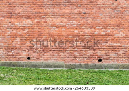 Red brick wall on a stone foundation