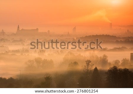 Vistula river valley and Krakow seen over the morning mists illuminated by rising sun