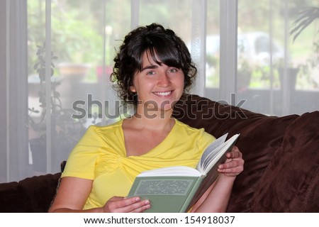 Young Woman Reading the Foreign Book