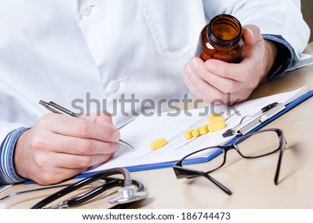 Doctor writing prescription.
