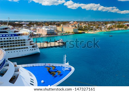 A view of a large cruise ship docked along the waterfront of Nassau, Bahamas.