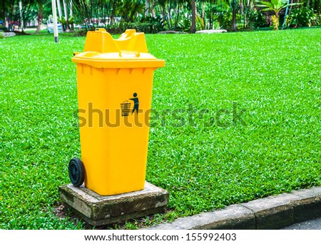 trash can yellow in park