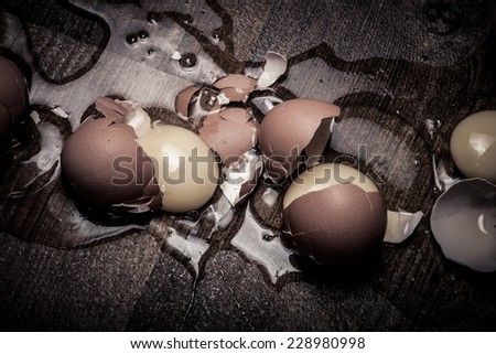 break eggs on the wooden floor