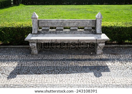 stone bench in a city park. Garden architecture.