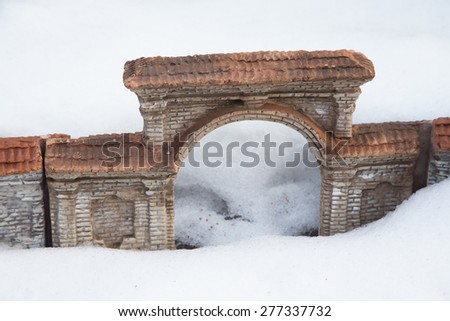 A miniature of the old brick arch in the snow.