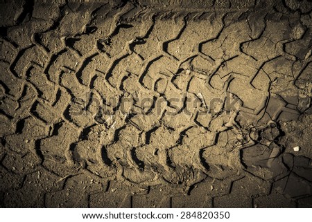 The imprint of the tire on wet sand. Toned.