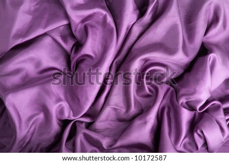 abstract background violet silk fabric with waves