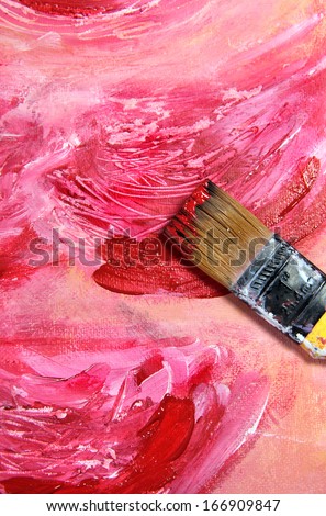 Paintbrush and beautiful painting of flowers in red and pink colors
