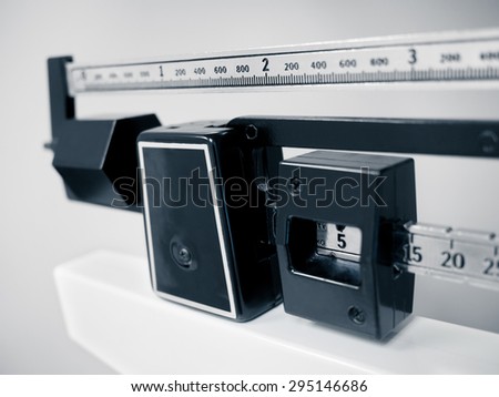 Hospital Medical Scale - Medical professional physician sliding balance weight scale at a doctor\'s office