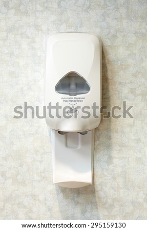 Picture of a wall mounted automatic sanitizer dispenser