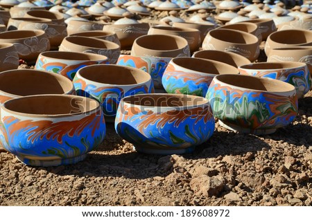 Handmade moroccan clay dishware in a pottery factory in Marrakesh