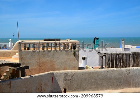View on Atlantic ocean with roofs of Essaouira white houses in Morocco, North Africa. The old part of town is the UNESCO world heritage sites.