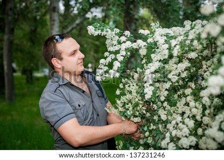 a young man with flowers