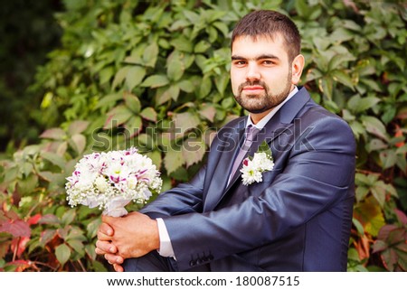 Elegant groom in tuxedo costume. Handsome caucasian man in tuxedo.