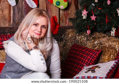 Christmas Woman. Beautiful New Year and Christmas Tree Holiday Hairstyle and Make up. Beauty Girl Portrait. Colorful Makeup, Hair, Nail polish and Accessories. Surprised Woman. Open Mouth, Emotions