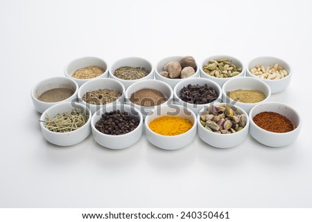 large collection of different spices and herbs isolated on white background
