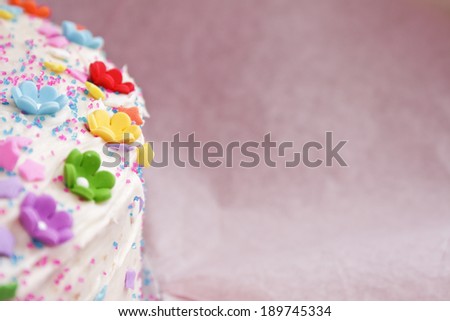 Birthday cake with colorful flowers and stars
