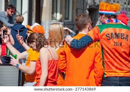 AMSTERDAM-APRIL 27: Street party during King\'s Day on April 27,2015 in Amsterdam, the Netherlands. Kings Day is the biggest festival celebrating the birth of Dutch royalty.