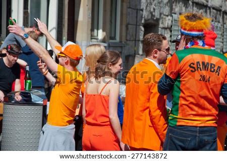 AMSTERDAM-APRIL 27: Open-air party during King\'s Day on April 27,2015 in Amsterdam, the Netherlands. Kings Day is the biggest festival celebrating the birth of Dutch royalty.