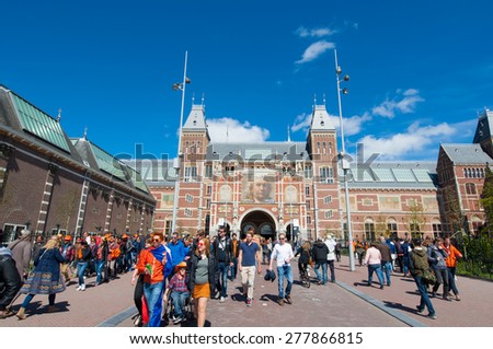 AMSTERDAM-APRIL 27: The Rijksmuseum during King\'s Day, crowd of people go to  Museumplein on April 27, 2015.The Rijksmuseum is a Netherlands national museum dedicated to arts and history in Amsterdam.