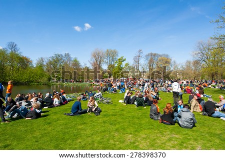 AMSTERDAM-APRIL 27: People in Vondelpark during King\'s Day on April 27,2015.King\'s Day is the largest open-air festivity in Amsterdam, the Netherlands.