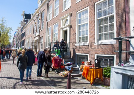 AMSTERDAM,NETHERLANDS-APRIL 27:  Street market of bric-a-brac during King\'s Day on April 27, 2015. King\'s Day is the largest open-air festivity in Amsterdam.