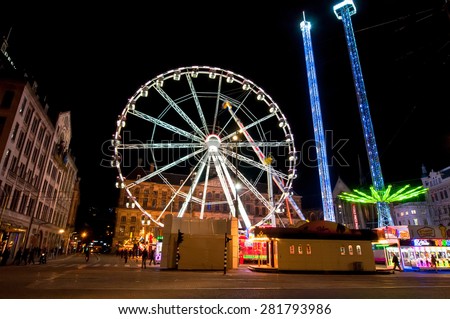 AMSTERDAM,NETHERLANDS-APRIL 27: Big wheel on Dam Square at night on King\'s Day on April 27,2015 in Amsterdam.  King\'s Day is the largest open-air festivity in Amsterdam.