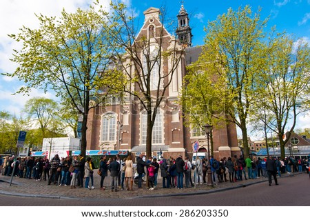 AMSTERDAM-APRIL 30: People stand in a queue to the Anne Frank House Museum on April 30,2015.The Anne Frank House Museum is one of Amsterdam\'s most popular and important museums opened in 1960.