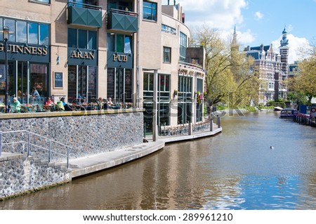 AMSTERDAM-APRIL 30: Locals and tourists have breakfast in Aran Irish Pub on April 30,2015, the Netherlands.  Aran Irish Pub is a very relaxing and enjoyable place.