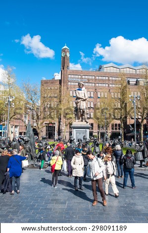 Amsterdam-April 30: Rembrandtplein with Rembrandt monument and representation The Night Watch, by Mikhail Dronov and Alexander Taratynov on April 30, 2015, the Netherlands.