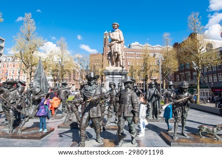Amsterdam-April 30: Rembrandtplein with a bronze-cast representation The Night Watch, by Russian artists Mikhail Dronov and Alexander Taratynov on April 30, 2015, the Netherlands.