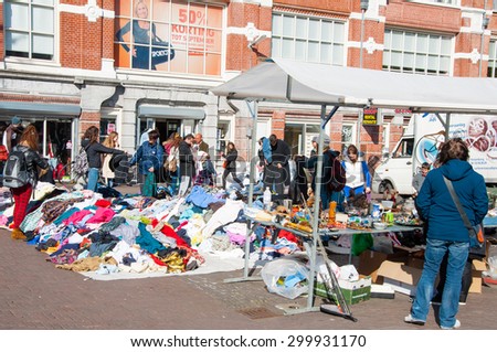 Amsterdam-April 30: People buy clothes in a sale on daily Flea market, Waterlooplein (Waterloo Square) on April 30,2015, the Netherlands.