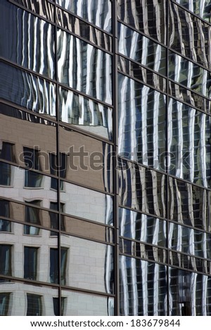 The abstract photograph of high-rise buildings and reflections in mirror windows / Mirror window