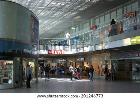 BERLIN, GERMANY - JUNE 16: The lobby of the Berlin East railway station with shops and travelers on June 16, 2014 in Berlin / Berlin East railway station