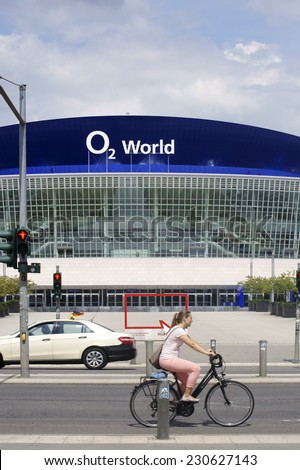 BERLIN, GERMANY - JUNE 16: A traffic light intersection with traffic in front of the building of the O2 World on June 16, 2014 in Berlin / O2 World Berlin