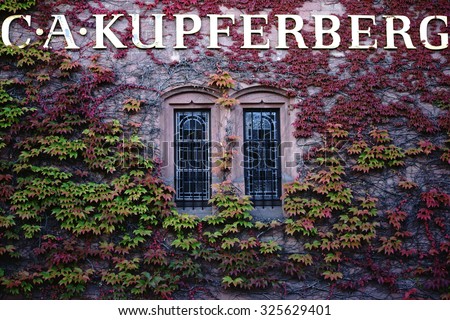 MAINZ, GERMANY - SEPTEMBER 19: The vine-covered facade of the headquarters of the company C.A. Kupferberg on September 19, 2015 in Mainz / Company C.A. Kupferberg Mainz
